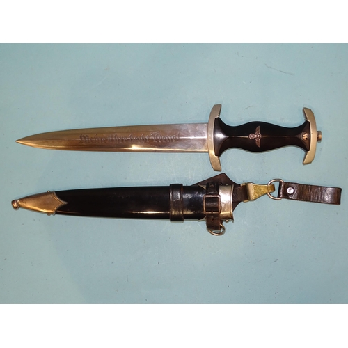 351 - Klittermann & Moog G.m.b.H, a German SS Nazi dagger with ebonised grip with metal eagle, swastik... 