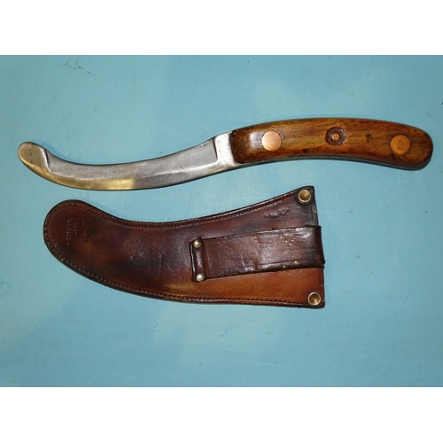 359 - A WWII paratrooper's parachute escape knife in leather scabbard, the 14cm blade with broad arrow and... 