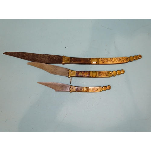 362 - Two small Navaja knives, each with horn and tortoiseshell grips, one stamped TOLEDO, both well-sprun... 