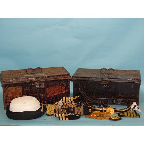 378 - Two fitted tin naval hat boxes by Gieves, a sword belt, seven pairs of Royal Navy Captain, Commander... 