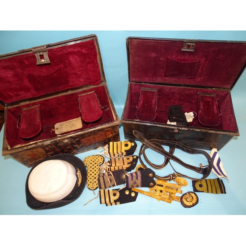 378 - Two fitted tin naval hat boxes by Gieves, a sword belt, seven pairs of Royal Navy Captain, Commander... 