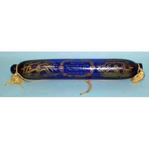 379 - A Bristol glass rolling pin enamelled with two ships and verse, 38cm long.