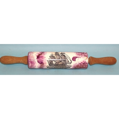 380 - A ceramic rolling pin with 