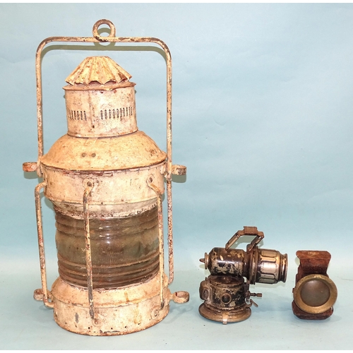 389 - A painted metal masthead lamp and two carbide lamps, (all a/f), (3).