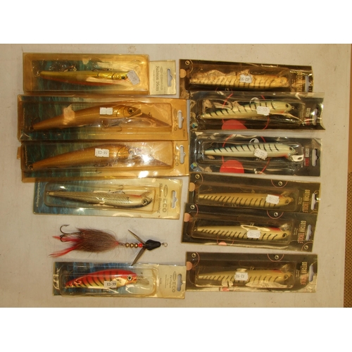 410 - A collection of twelve large artificial salmon baits and a quantity of soft baits and miscellaneous ... 