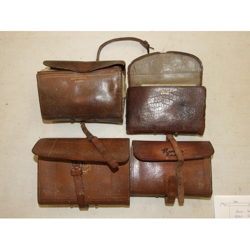 412 - Four leather fly wallets by Hardy Bros, containing flies and casts.