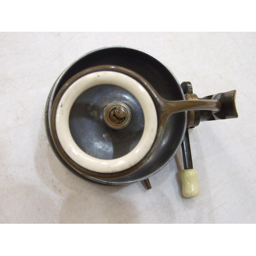 418 - A Mallocks Patent side-caster reel of alloy with bronze foot, ratchet knob and arm with ceramic line... 