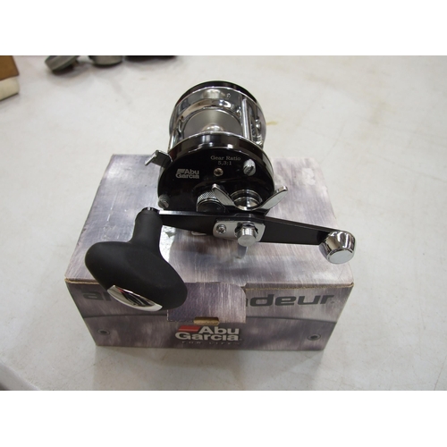 427 - An Abu Garcia Ambassadeur multiplying reel in leather case, with oil bottle and spanner.... 