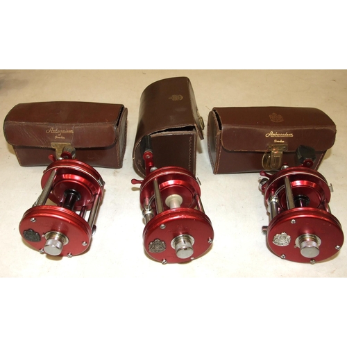 430 - An Abu Ambassadeur 6000 multiplier reel, in good order, in case and two similar multiplier reels in ... 