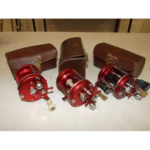 430 - An Abu Ambassadeur 6000 multiplier reel, in good order, in case and two similar multiplier reels in ... 