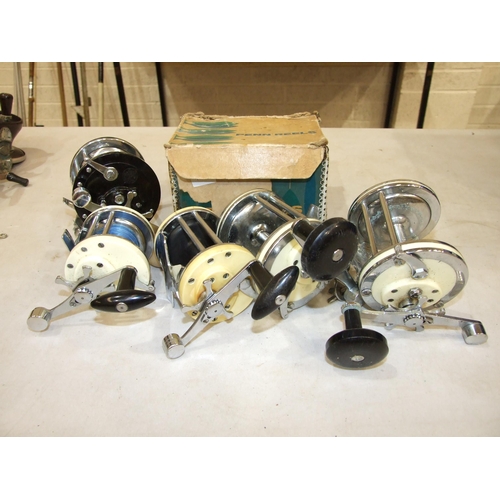 435 - A Penn Long Beach 67 multiplying reel, two Mitchell 624, Mitchell 600, Mitchell 602 reels, (all in u... 