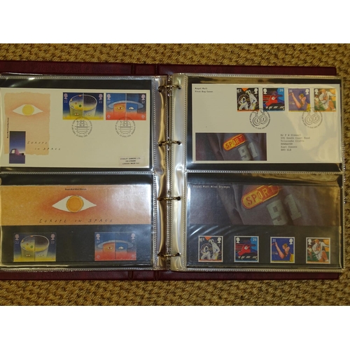 157 - A collection of Great British presentation packs, mint sets and first day covers, in thirty-one albu... 