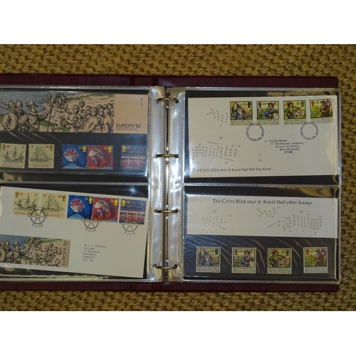 157 - A collection of Great British presentation packs, mint sets and first day covers, in thirty-one albu... 