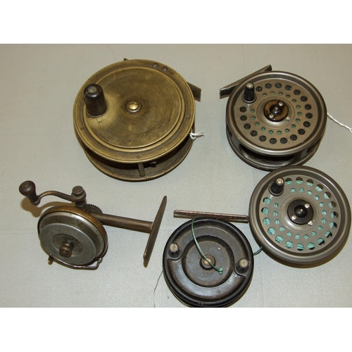 417 - A 4.3/8'' brass salmon reel, a 3½'' Intrepid trout reel, with spare reel, a hand-made brass a... 