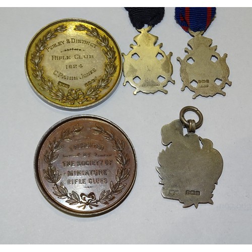 201 - A silver Purley & District Rifle Club Archer medal 1924, seven small silver Miniature Rifle Club... 