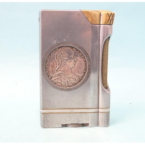 72 - An unusual trench art-style aluminium and brass table lighter inset on each side a Marie Therese tha... 