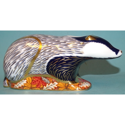 Three Royal Crown Derby ceramic paperweights: Woodland Badger (gold button, boxed), Mouse (gold button, boxed) and Badger (gold button, unboxed), (3).
