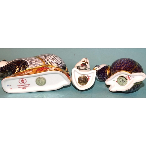 109 - Three Royal Crown Derby ceramic paperweights: Woodland Badger (gold button, boxed), Mouse (gold butt... 