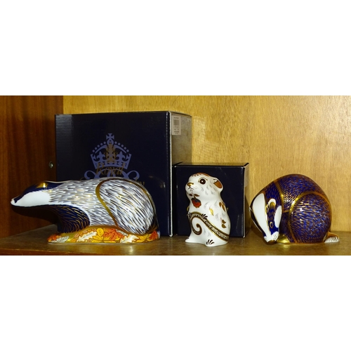 109 - Three Royal Crown Derby ceramic paperweights: Woodland Badger (gold button, boxed), Mouse (gold butt... 