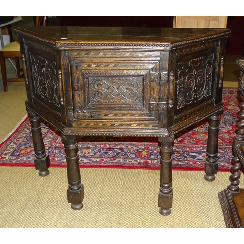 2 - A reproduction carved wood sideboard of trapezoid shape and raised on four turned legs, 92cm high, 1... 