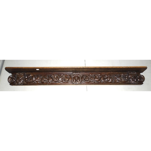 2 - A reproduction carved wood sideboard of trapezoid shape and raised on four turned legs, 92cm high, 1... 