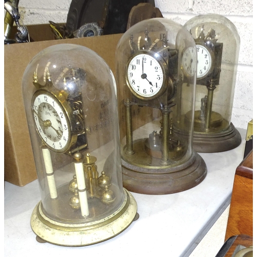 28 - Two brass 400-day clocks under glass domes, 28cm high, a 'Koma' 400-day clock under glass dome, 25cm... 