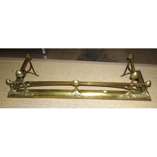 3 - An Art Nouveau brass fire fender of naturalistic design, 136cm wide, 30cm high, 36.5cm deep.... 