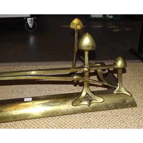 3 - An Art Nouveau brass fire fender of naturalistic design, 136cm wide, 30cm high, 36.5cm deep.... 