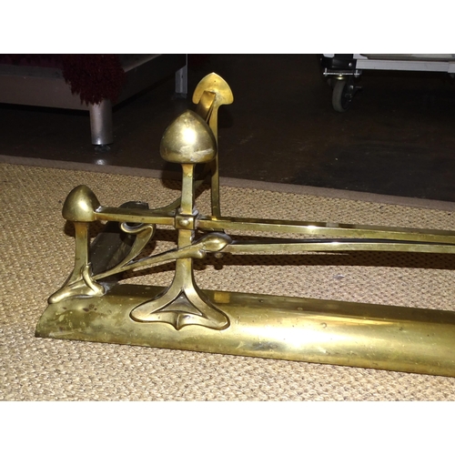 3 - An Art Nouveau brass fire fender of naturalistic design, 136cm wide, 30cm high, 36.5cm deep.... 