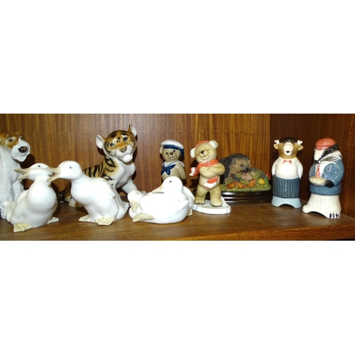 56 - Three Lomonosov porcelain sculptures of a tiger cub and two terriers, two Nao dove figures and other... 