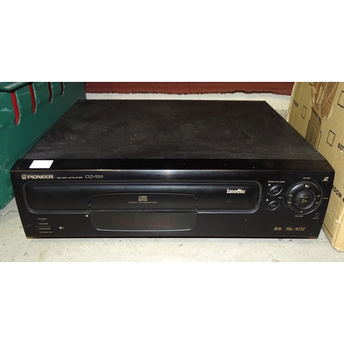 64 - A Pioneer CLD-S315 laser disc player, (no remote control), together with thirty laser discs, includi... 