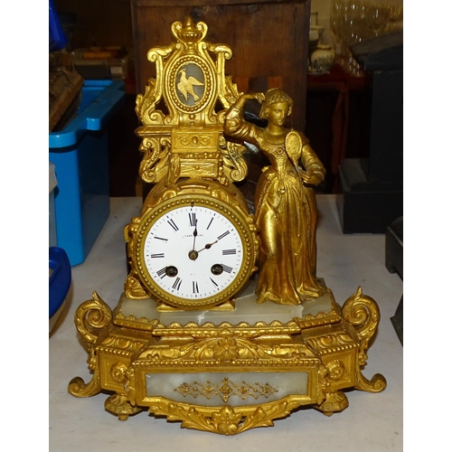 66 - A gilt metal and marble mantel clock with drum movement striking on a bell, surmounted by a female f... 