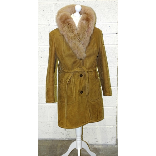 84 - A lady's long brown suede double-breasted coat, belted, with honey-coloured fur collar and lapels, s... 