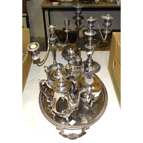 89 - A small collection of plated ware, including a four-piece tea service, candelabrum, etc.... 