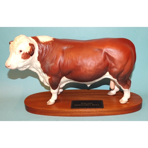 99 - A Beswick Connoisseur sculpture 'Polled Hereford Bull', on wooden plinth, 19cm high overall.... 