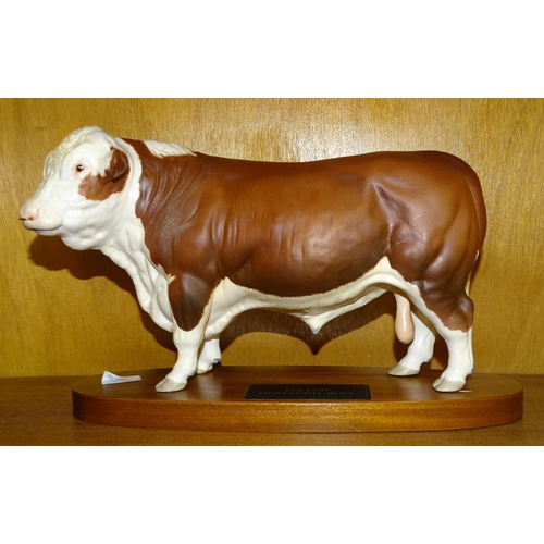 99 - A Beswick Connoisseur sculpture 'Polled Hereford Bull', on wooden plinth, 19cm high overall.... 