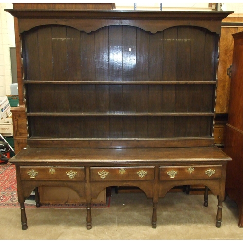 10 - An 18th century oak dresser base fitted with three drawers, on short turned legs, 207cm wide, 49cm d... 