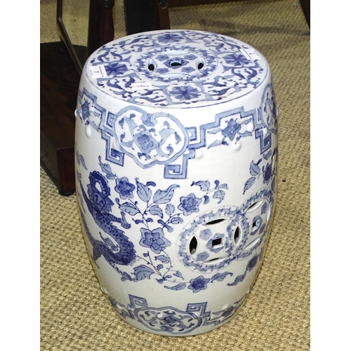 7 - A reproduction Oriental blue and white barrel-shaped ceramic garden seat, 43cm high.... 