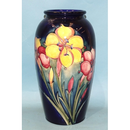 107 - A William Moorcroft 'Freesia' decorated baluster vase with signed and impressed marks beneath, 32cm ... 