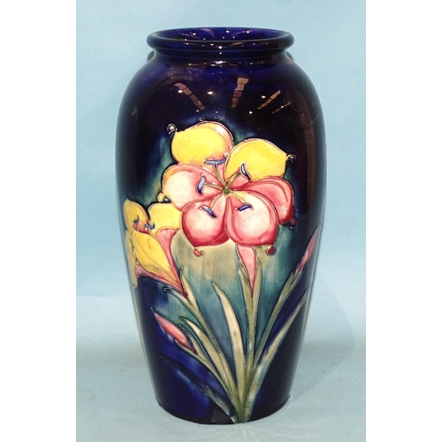 107 - A William Moorcroft 'Freesia' decorated baluster vase with signed and impressed marks beneath, 32cm ... 