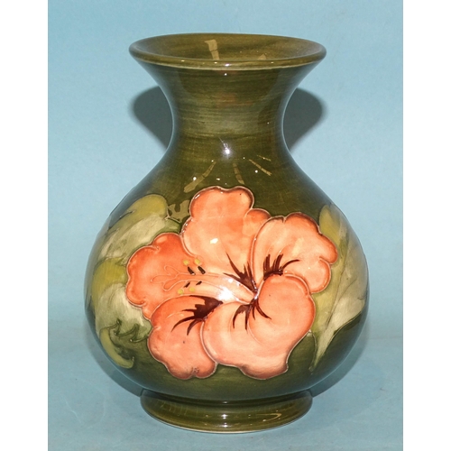 110 - A Moorcroft 'Hibiscus' baluster shape vase with green glaze, 'Potters to the late Queen Mary' beneat... 