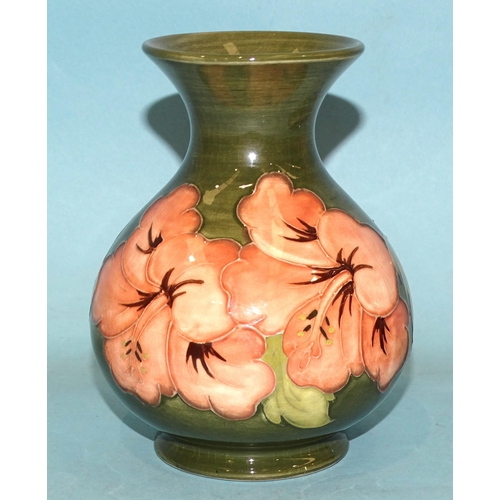 110 - A Moorcroft 'Hibiscus' baluster shape vase with green glaze, 'Potters to the late Queen Mary' beneat... 