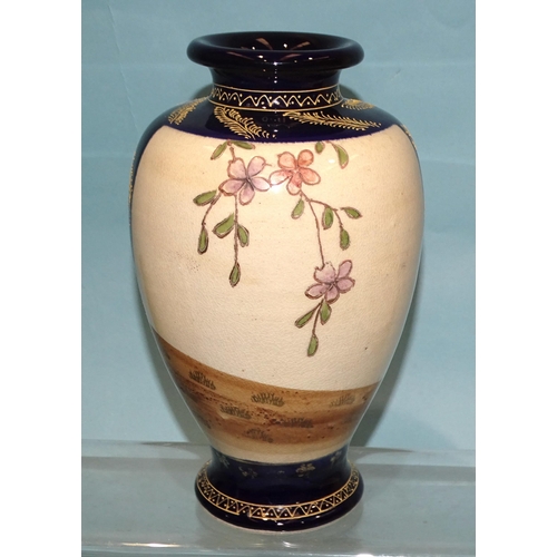 127 - A Japanese arita baluster-shaped vase with flared neck, decorated with panels of geisha and flowers ... 