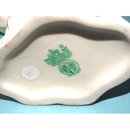 131 - A Belleek strap-moulded tazza, the dish with central armorial and motto Metuenda Corolla Draconis, 2... 