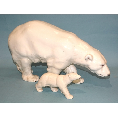 133 - A large mid-20th century ceramic model of a polar bear, 46cm long, 27cm high, impressed 13365,29 and... 