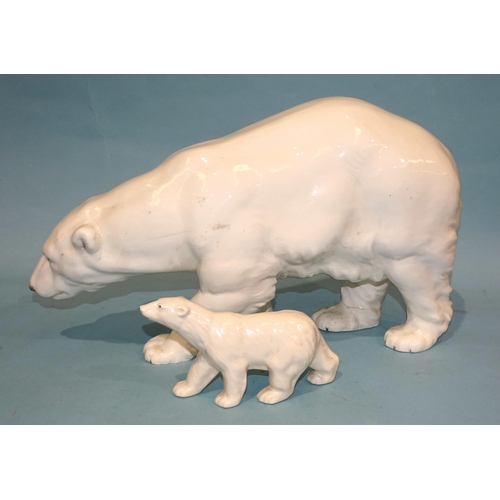 133 - A large mid-20th century ceramic model of a polar bear, 46cm long, 27cm high, impressed 13365,29 and... 