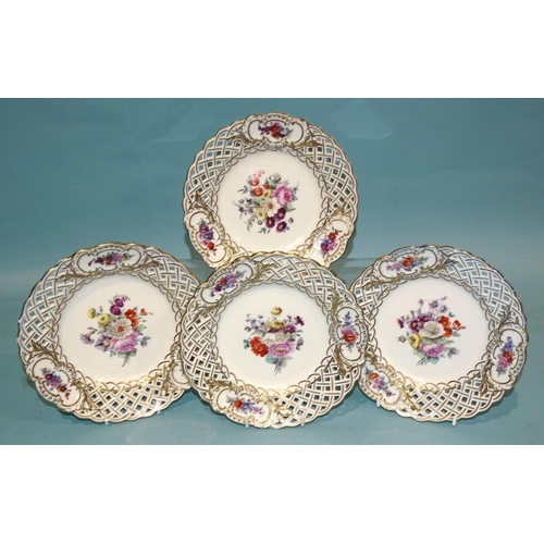 138 - A set of four 19th century Meissen porcelain pierced plates painted with flower sprays and gilded th... 