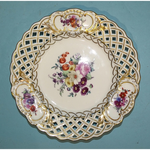 138 - A set of four 19th century Meissen porcelain pierced plates painted with flower sprays and gilded th... 