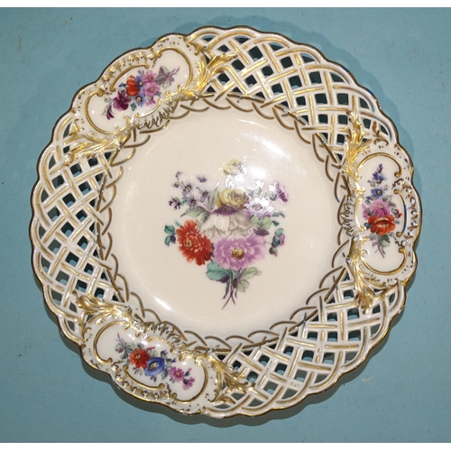 138 - A set of four 19th century Meissen porcelain pierced plates painted with flower sprays and gilded th... 