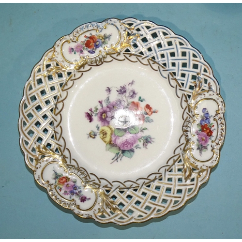 138 - A set of four 19th century Meissen porcelain pierced plates painted with flower sprays and gilded th... 